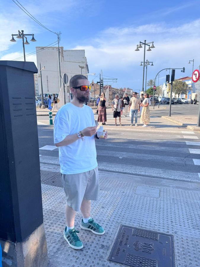 Jamie eating ice cream on a Valencia street corner
